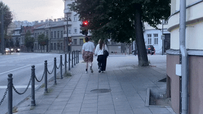 People passing under the tree